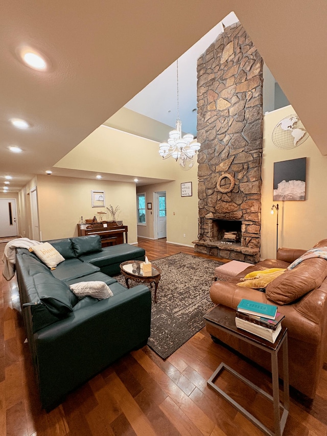 2412 S Camber Ave, Springfield, MO 65809 - living area featuring wood-type flooring, a chandelier, a fireplace, recessed lighting, and a high ceiling