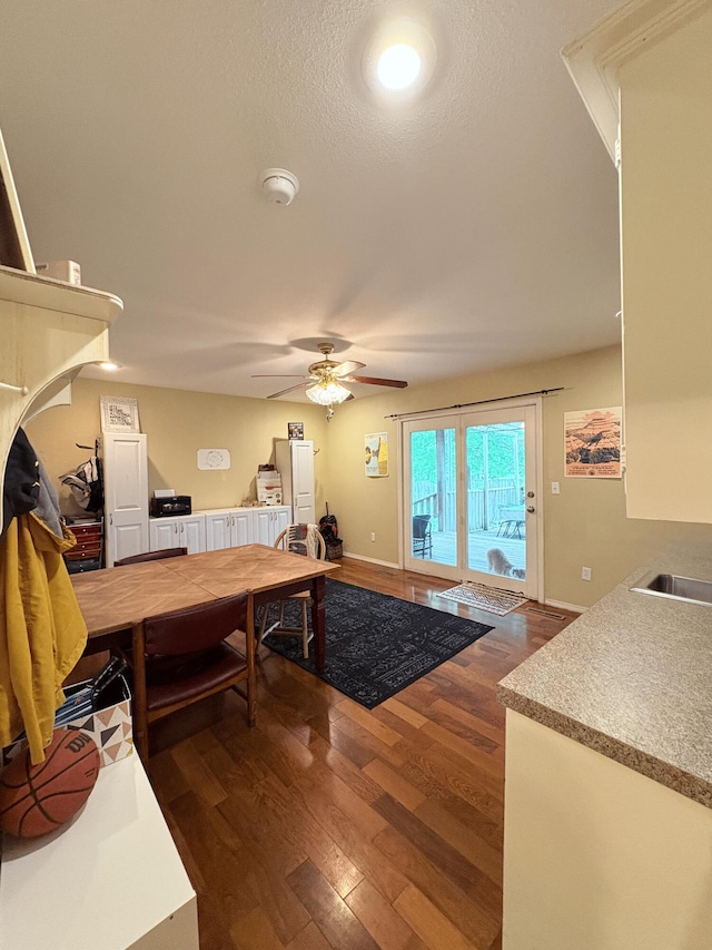 2412 S Camber Ave, Springfield, MO 65809 - living room featuring dark wood-type flooring and a ceiling fan