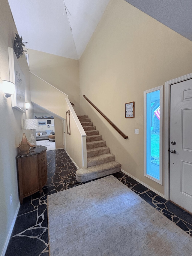 2412 S Camber Ave, Springfield, MO 65809 - carpeted entrance foyer featuring high vaulted ceiling and stairs