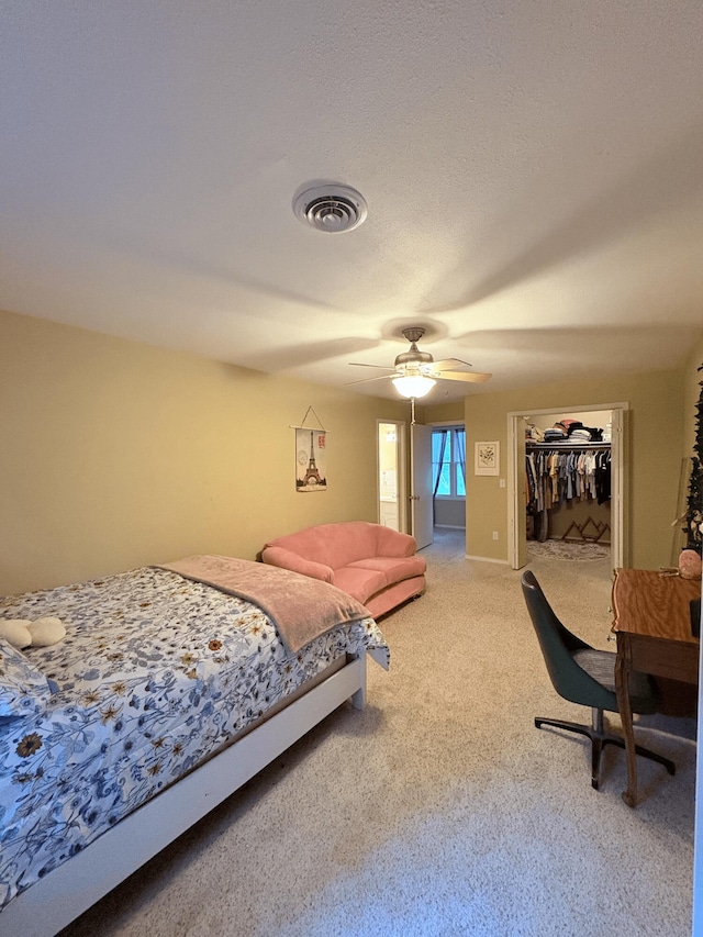 2412 S Camber Ave, Springfield, MO 65809 - bedroom with light colored carpet, a ceiling fan, a closet, and a spacious closet