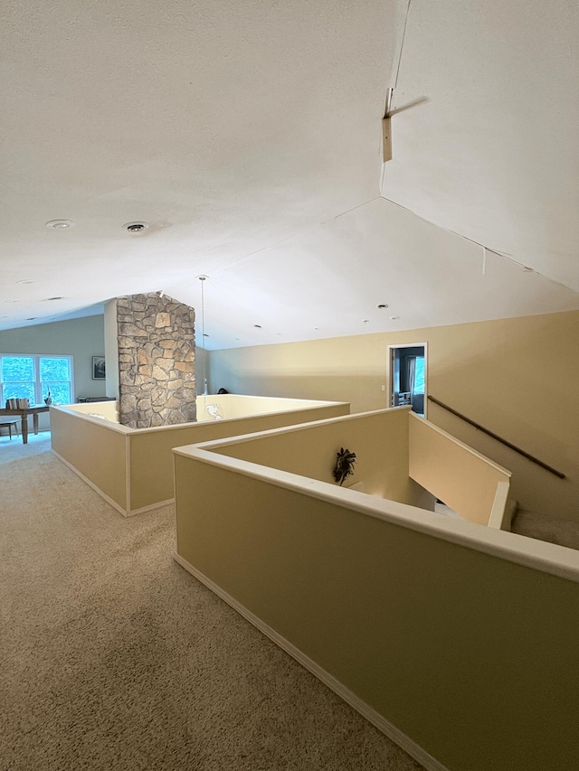 2412 S Camber Ave, Springfield, MO 65809 - hallway featuring vaulted ceiling and carpet flooring