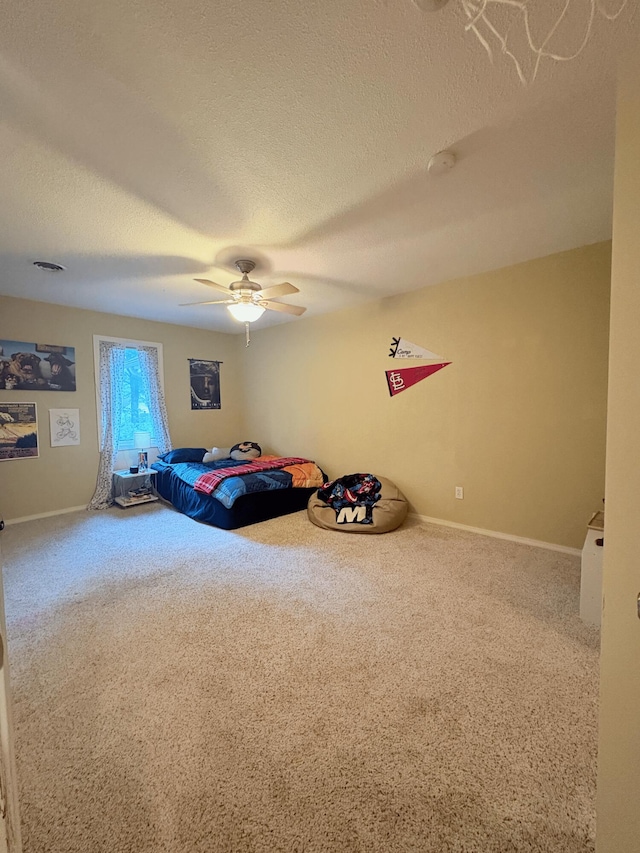 2412 S Camber Ave, Springfield, MO 65809 - unfurnished bedroom with carpet floors, a textured ceiling, and ceiling fan