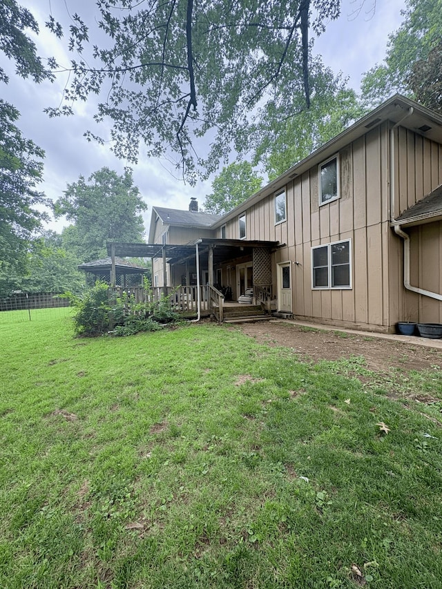2412 S Camber Ave, Springfield, MO 65809 - rear view of house with board and batten siding and a deck