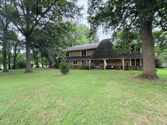2412 S Camber Ave, Springfield, MO 65809 - view of front of property featuring a front lawn, roof with shingles, and covered porch