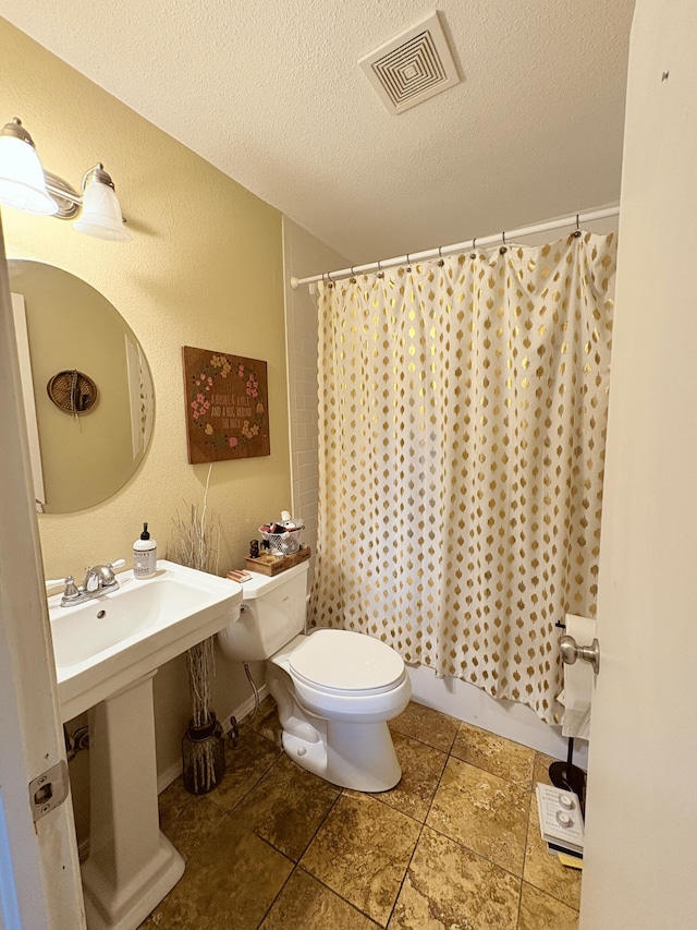 2412 S Camber Ave, Springfield, MO 65809 - bathroom with toilet and a textured ceiling