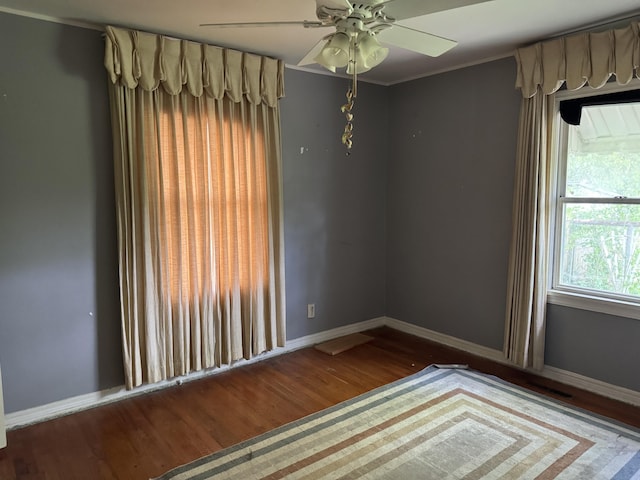 522 W Catalpa St, Springfield, MO 65807 - unfurnished room featuring wood finished floors, a ceiling fan, and crown molding