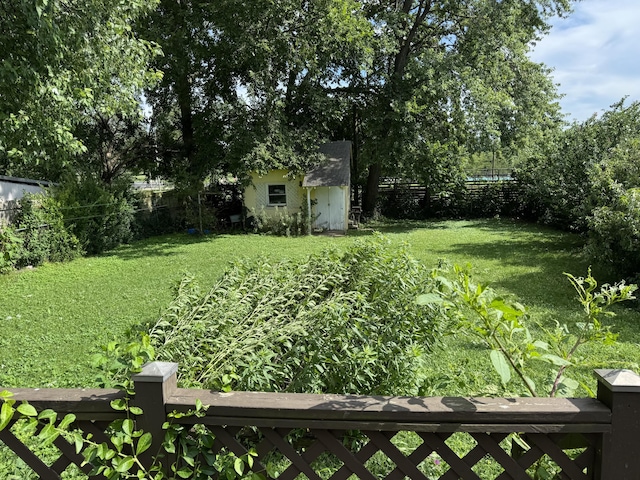 522 W Catalpa St, Springfield, MO 65807 - fenced backyard featuring a storage unit