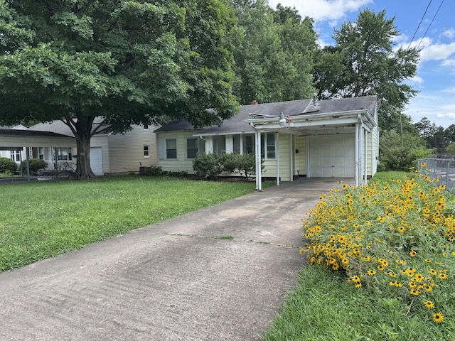 522 W Catalpa St, Springfield, MO 65807 - ranch-style house featuring an attached garage, a front lawn, and concrete driveway