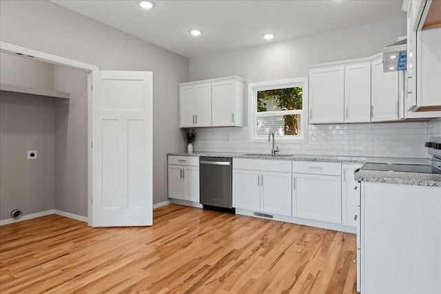 3001 E Colonial Ct, Republic, MO 65738 - kitchen with stainless steel dishwasher, light wood-type flooring, decorative backsplash, white cabinetry, and recessed lighting