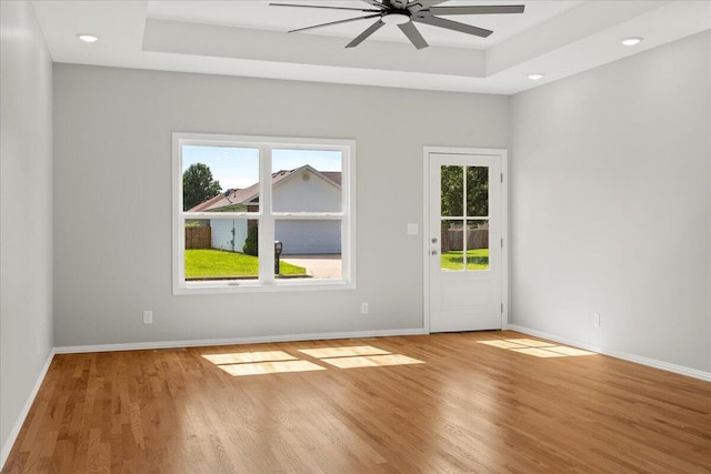 3001 E Colonial Ct, Republic, MO 65738 - spare room with a tray ceiling, wood finished floors, a ceiling fan, and recessed lighting