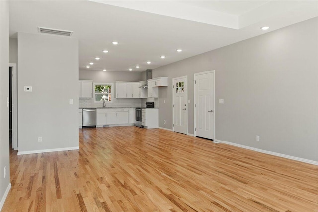 3001 E Colonial Ct, Republic, MO 65738 - unfurnished living room with light wood finished floors and recessed lighting