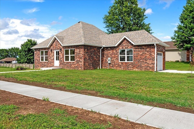3001 E Colonial Ct, Republic, MO 65738 - view of front of home with an attached garage, brick siding, a front lawn, and roof with shingles