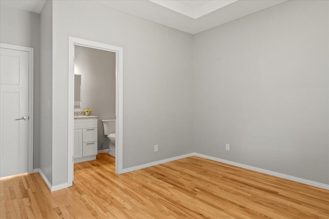 3001 E Colonial Ct, Republic, MO 65738 - unfurnished bedroom with light wood-style floors and ensuite bathroom