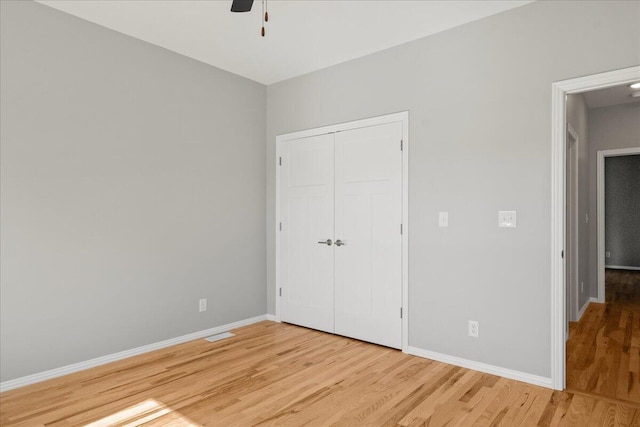 3001 E Colonial Ct, Republic, MO 65738 - unfurnished bedroom with light wood finished floors, a closet, and a ceiling fan