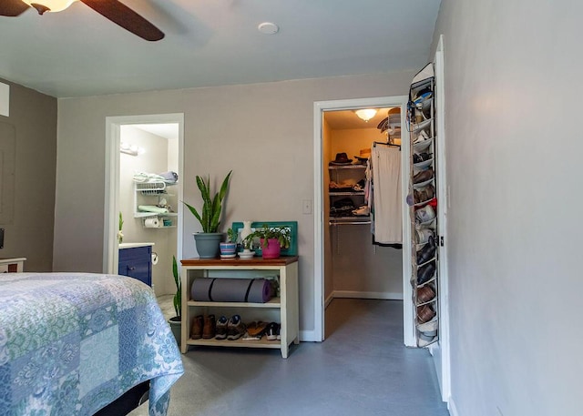 1050 S Glenn Ave, Springfield, MO 65802 - bedroom featuring a spacious closet, finished concrete floors, ensuite bathroom, ceiling fan, and a closet