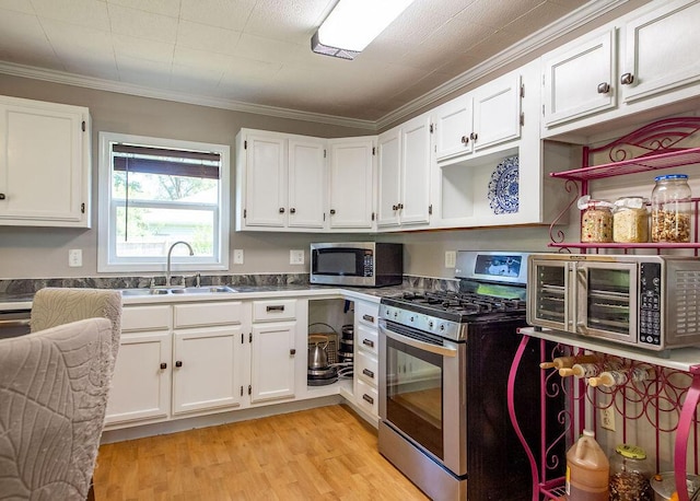 1050 S Glenn Ave, Springfield, MO 65802 - kitchen with stainless steel appliances, white cabinetry, light wood-style floors, crown molding, and open shelves