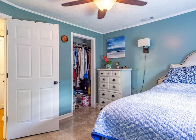 1050 S Glenn Ave, Springfield, MO 65802 - bedroom with ornamental molding, a closet, and a ceiling fan