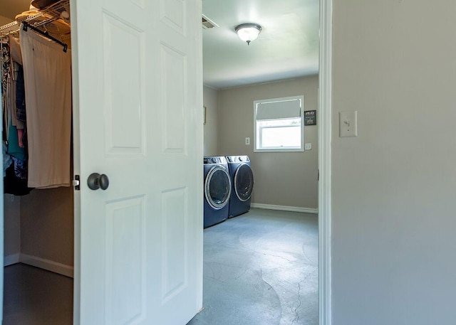 1050 S Glenn Ave, Springfield, MO 65802 - washroom with washing machine and dryer and baseboards