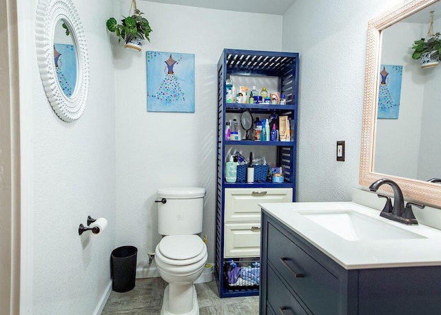 1050 S Glenn Ave, Springfield, MO 65802 - half bath with vanity, wood finished floors, and a textured wall