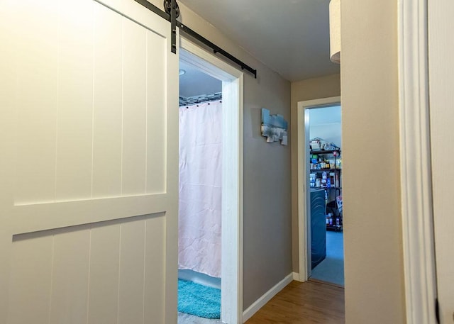 1050 S Glenn Ave, Springfield, MO 65802 - hallway with wood finished floors and a barn door