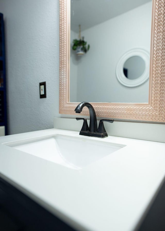 1050 S Glenn Ave, Springfield, MO 65802 - bathroom view of vanity and a textured wall