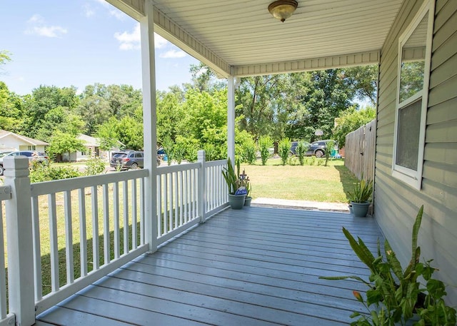 1050 S Glenn Ave, Springfield, MO 65802 - wooden terrace featuring a lawn and view of wooded area