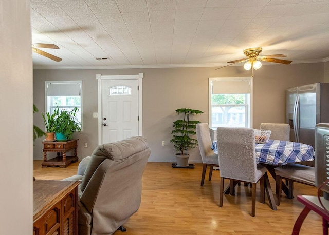 1050 S Glenn Ave, Springfield, MO 65802 - dining room with a ceiling fan, healthy amount of natural light, light wood-style floors, and ornamental molding
