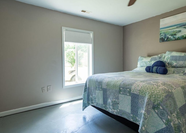 1050 S Glenn Ave, Springfield, MO 65802 - bedroom with concrete flooring and baseboards