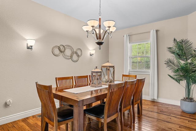 128 Mulligan Ct, Branson, MO 65616 - dining room featuring a chandelier and hardwood / wood-style floors