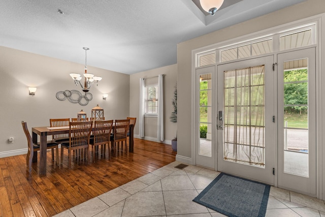 128 Mulligan Ct, Branson, MO 65616 - dining area with a chandelier and wood finished floors