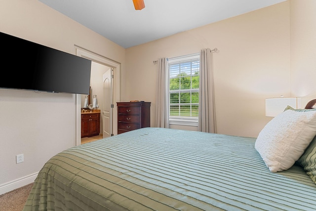 128 Mulligan Ct, Branson, MO 65616 - bedroom featuring carpet, connected bathroom, and ceiling fan