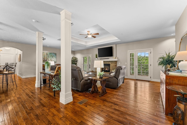 128 Mulligan Ct, Branson, MO 65616 - living area featuring a ceiling fan, a tray ceiling, and hardwood / wood-style floors