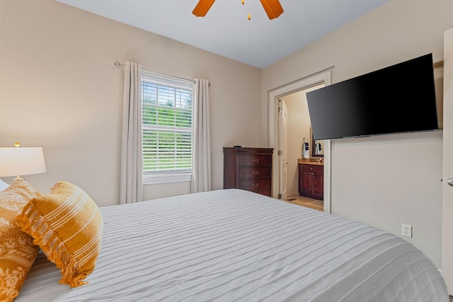 128 Mulligan Ct, Branson, MO 65616 - bedroom with ceiling fan and ensuite bath