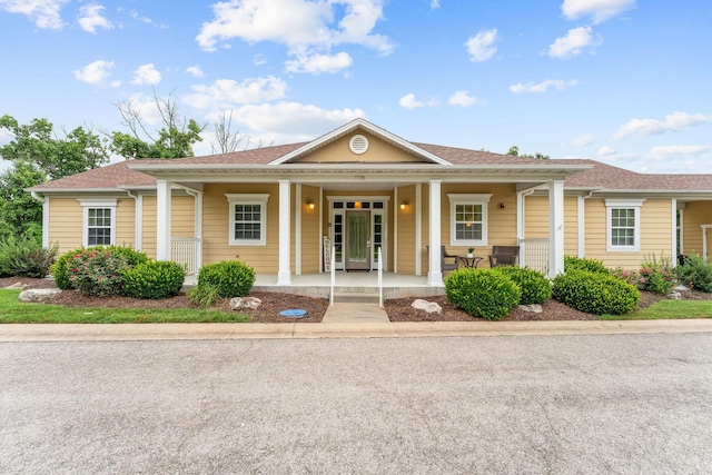 128 Mulligan Ct, Branson, MO 65616 - view of front facade featuring a porch and a shingled roof