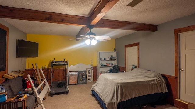 12 Riverbend Rd, Mammoth Spring, AR 72554 - bedroom with carpet flooring, beam ceiling, a textured ceiling, and a ceiling fan