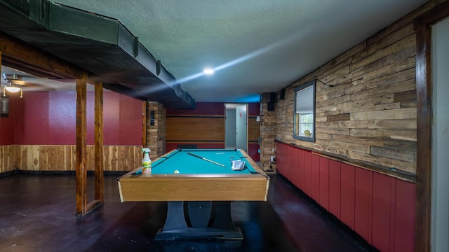 12 Riverbend Rd, Mammoth Spring, AR 72554 - game room with wood walls, a wainscoted wall, concrete floors, billiards, and a textured ceiling
