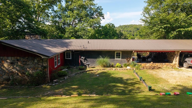 12 Riverbend Rd, Mammoth Spring, AR 72554 - ranch-style house with stone siding, a front lawn, a carport, and a metal roof