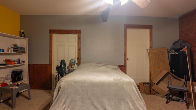 12 Riverbend Rd, Mammoth Spring, AR 72554 - carpeted bedroom featuring wood walls and a ceiling fan