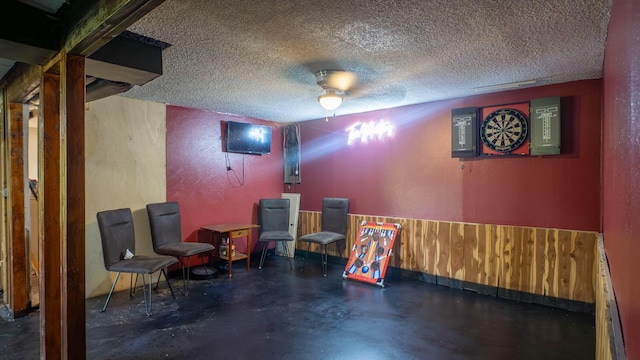 12 Riverbend Rd, Mammoth Spring, AR 72554 - cinema room featuring a textured ceiling, concrete floors, and a textured wall
