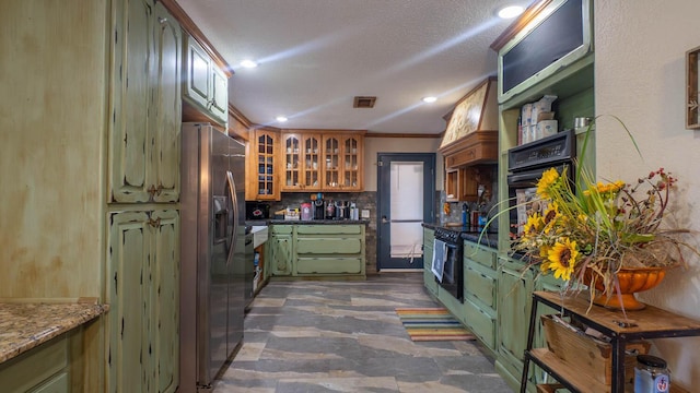 12 Riverbend Rd, Mammoth Spring, AR 72554 - kitchen featuring green cabinets, black appliances, recessed lighting, a textured ceiling, and glass insert cabinets