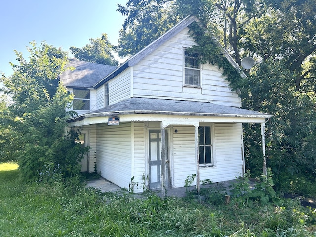 202 High St, Mansfield, MO 65704 - view of front of home featuring covered porch and roof with shingles