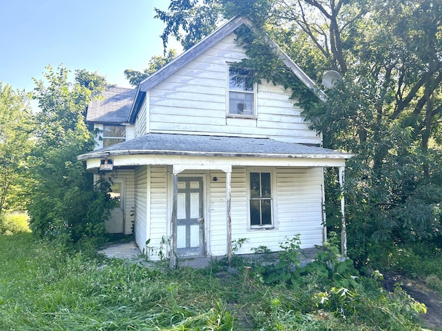 202 High St, Mansfield, MO 65704 - view of front facade with a shingled roof