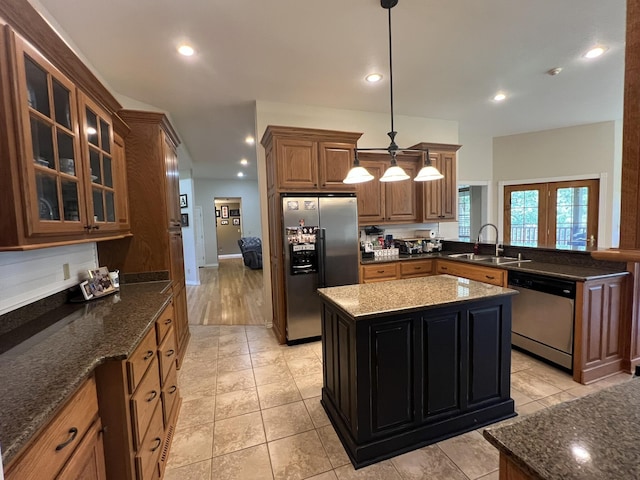 7876 County Road 3400, Mountain View, MO 65548 - kitchen with stainless steel appliances, recessed lighting, glass insert cabinets, hanging light fixtures, and dark stone countertops