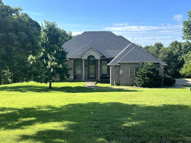 7876 County Road 3400, Mountain View, MO 65548 - french provincial home with a front lawn, roof with shingles, and brick siding