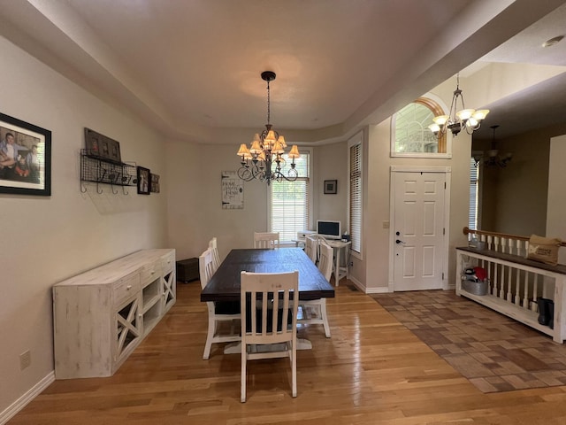 7876 County Road 3400, Mountain View, MO 65548 - dining space featuring a chandelier, light wood finished floors, and a raised ceiling