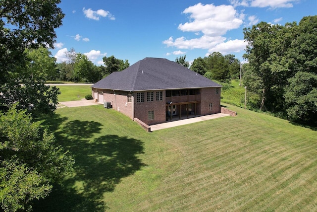 7876 County Road 3400, Mountain View, MO 65548 - back of property with a patio, a yard, concrete driveway, and brick siding