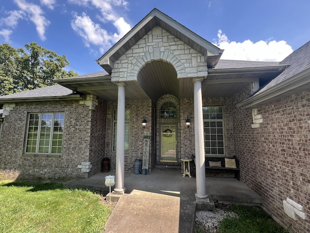 7876 County Road 3400, Mountain View, MO 65548 - property entrance featuring brick siding, covered porch, and a shingled roof
