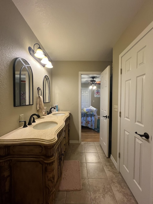 7876 County Road 3400, Mountain View, MO 65548 - bathroom featuring double vanity, tile patterned flooring, ceiling fan, and connected bathroom