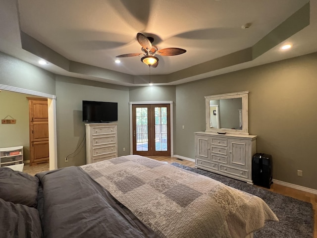 7876 County Road 3400, Mountain View, MO 65548 - bedroom featuring a raised ceiling, recessed lighting, light wood finished floors, french doors, and a ceiling fan