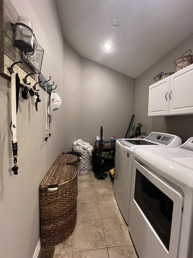 7876 County Road 3400, Mountain View, MO 65548 - laundry room with cabinet space, separate washer and dryer, and light tile patterned floors